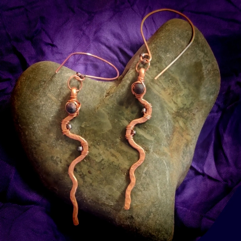 Handcrafted brushed copper earrings with iridescent blue glass beads